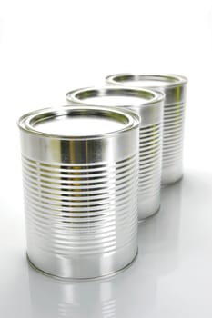 Tin cannisters isolated against a white background