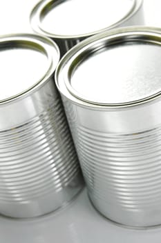 Tin cannisters isolated against a white background
