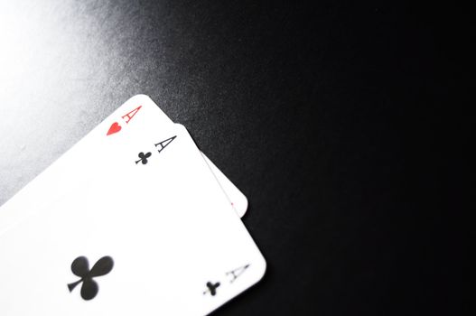 card game with aces on black background