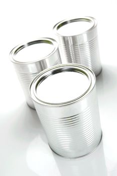 Tin cannisters isolated against a white background