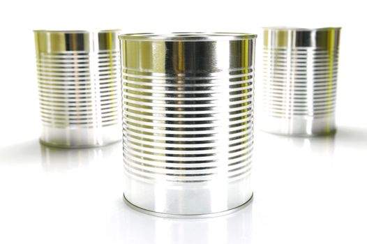 Tin cannisters isolated against a white background