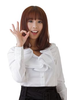 Cute business woman give you an ok gesture against white.
