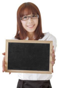 Asian business woman holding blank blackboard, focus on board.