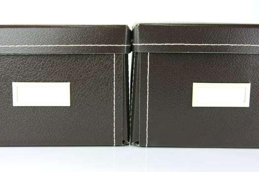 Brown stationery boxes isolated against a white background