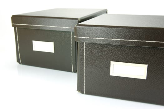 Brown stationery boxes isolated against a white background