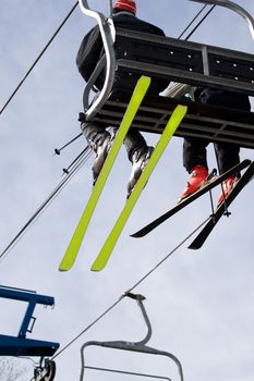 Some people ride the chair lift to the top of the mountain so they can ski back down.