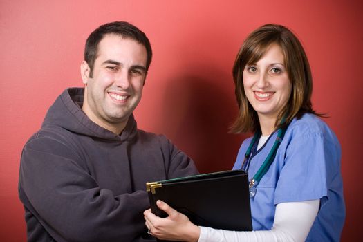 A young nurse and her patient during his visit.