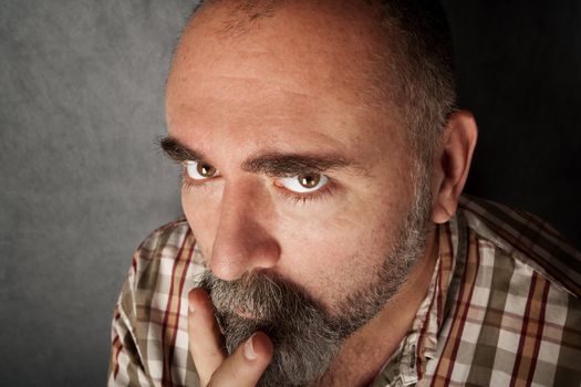 Closeup of a man in his forties with mustache