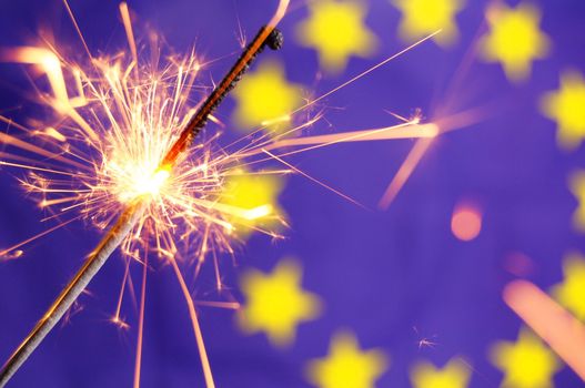 euro or european union flag and holiday sparkler showing celebration