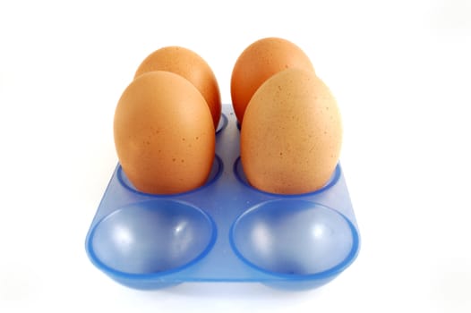 Egg carton with eggs on white background