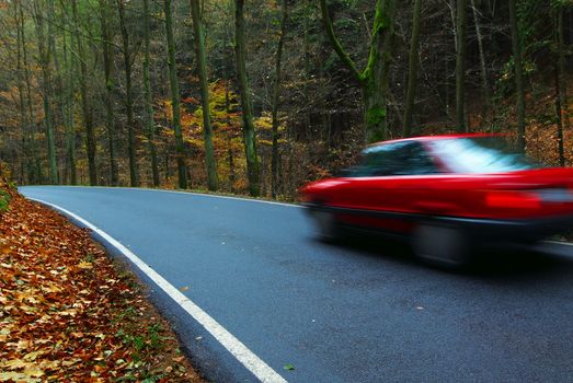 Red car on the small road