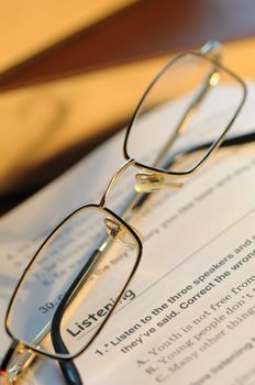 The combined glasses lay on the textbook