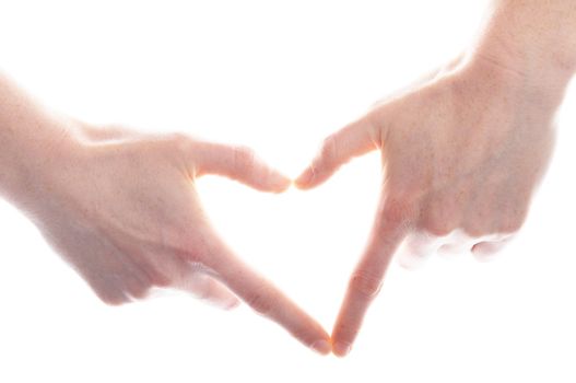 hand and heart isolated on white background showing love concept