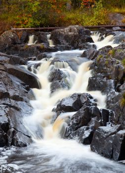 mountain waterfall. fast stream water. autumn landscape