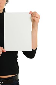 The woman holds empty sheet of paper isolated on white background