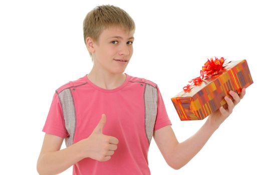 The joyful teenager with a gift isolated on white background