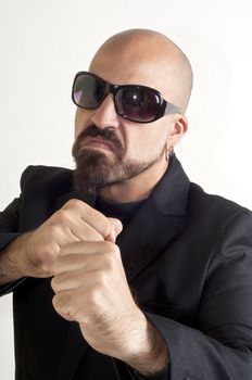 blacks man with glasses, beard and black jacket, bouncer bodyguard