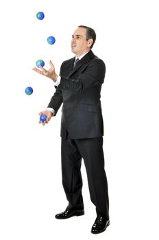 Business man in suit juggling planet earth balls