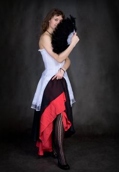 Portrait of the girl with a fan in hand