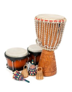 Percussion music instruments: djembe drum, bongos and caxixi shakers.