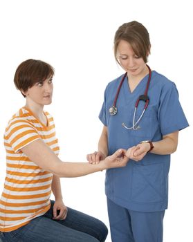 Competent young nurse measuring patient's pulse.