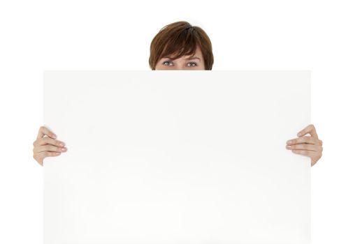 Smiling eyes behind a banner ad. Young woman holding blank cardboard.