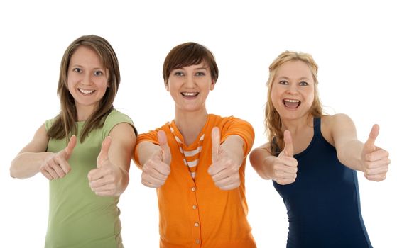 Three happy and energetic young women giving thumbs up.