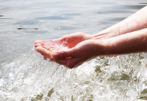 hand and splashing cold drink water showing nature concept