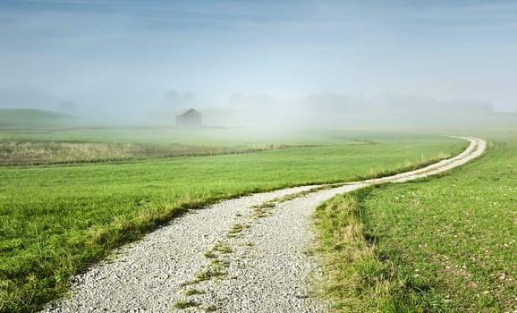 An image of a beautiful landscape with fog in bavaria germany