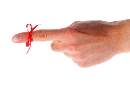 reminder concept with hand and red bow isolated on white background