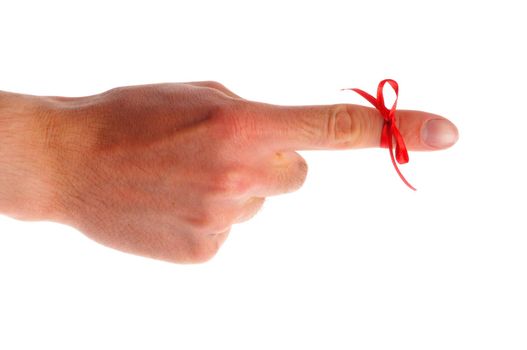 red bow on male finger showing reminder or dont forget concept in white