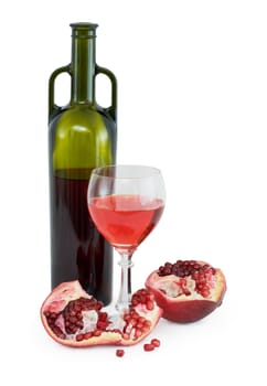 Still-life with a glass of wine, bottle and a red pomegranate