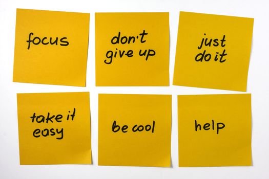 six yellow sticky notes with reminders and motivational phrases on white background