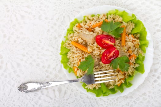 meat with vegetables and rice on plate