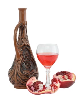 Still-life with a glass of wine, bottle and a red pomegranate