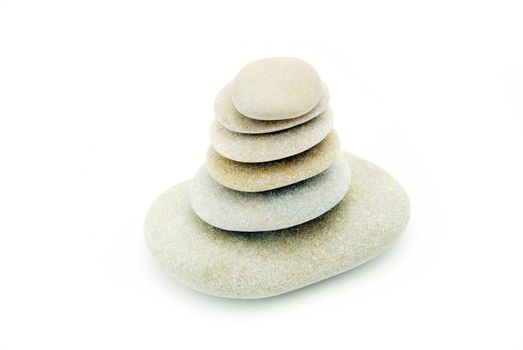 Stack of balanced stones on a white background