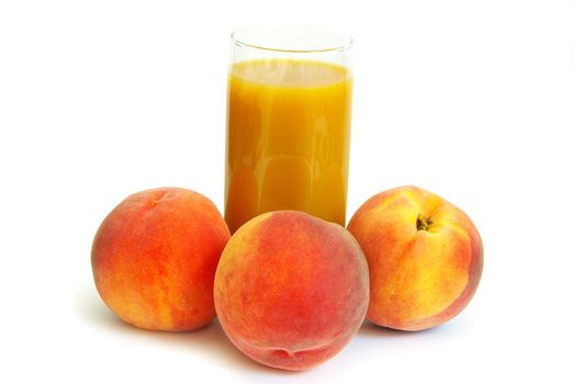 Glass with freshly made peach juice on a white background