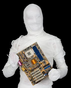 Bandaged man with motherboard on black background