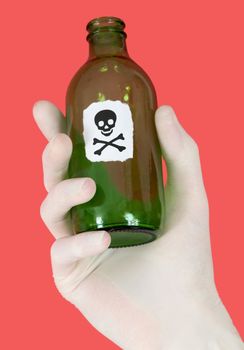Green bottle with skull and crossbones on hand