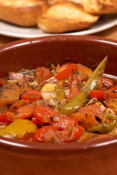 Traditional Spanish vegetable stew, pisto, served in a clay pot