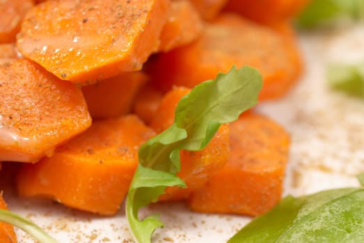 Detail take of a fresh carrot salad with rocked and cumin