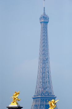 Panorama of Eiffel tower and goldish sculptures