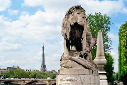Sculpture lion on the bridge Alexander's III in Paris. Photo with tilt-shift lens