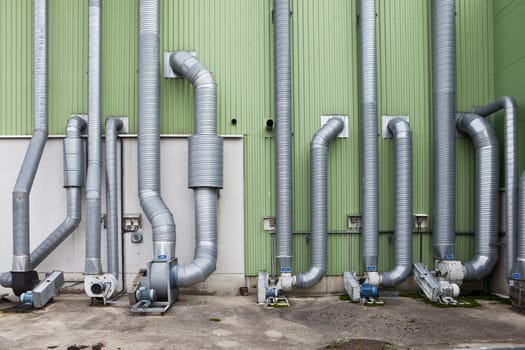 Industry pipes outside a warehouse building