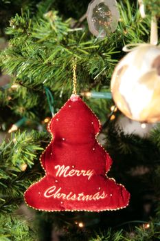 a christmas tree decoration hanging from the tree