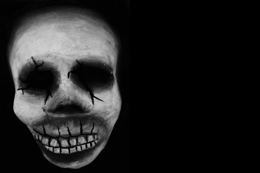 A typical mardi grass skull over a black backdrop