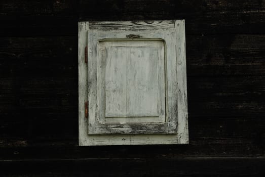  white window with a wooden backround
