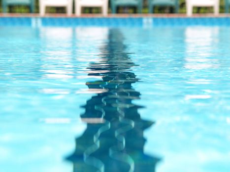 Closeup of the distortions of a swimming lane marker in a pool  