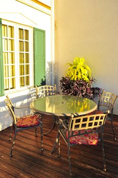 Patio chairs and tables on wooden patio deck