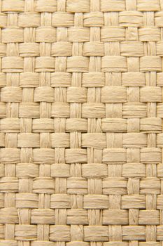 Close up of abstract yellow woven thatch textured background